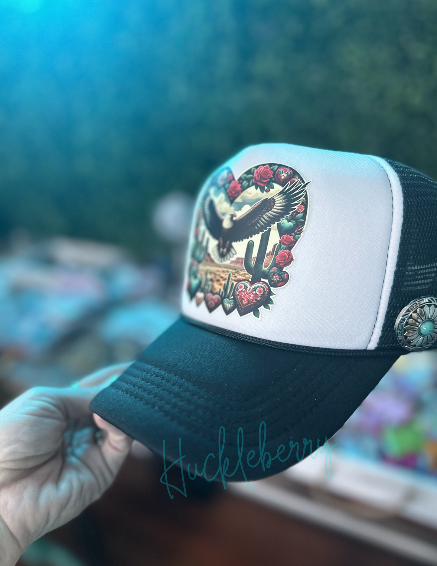 Trucker with Eagle soaring in a western scene. Accented with 3 turquoise rivets and 1 concho