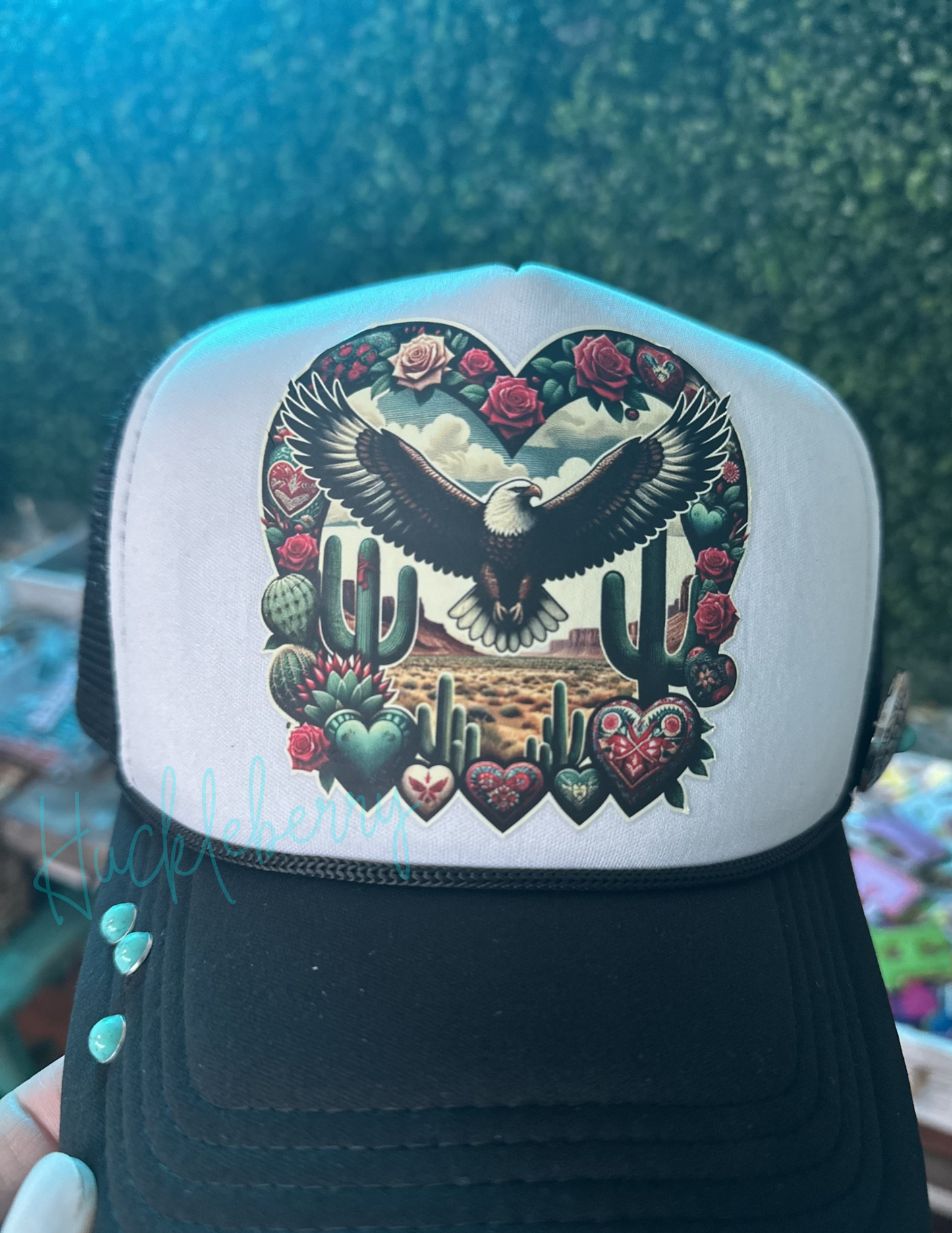 Trucker with Eagle soaring in a western scene. Accented with 3 turquoise rivets and 1 concho